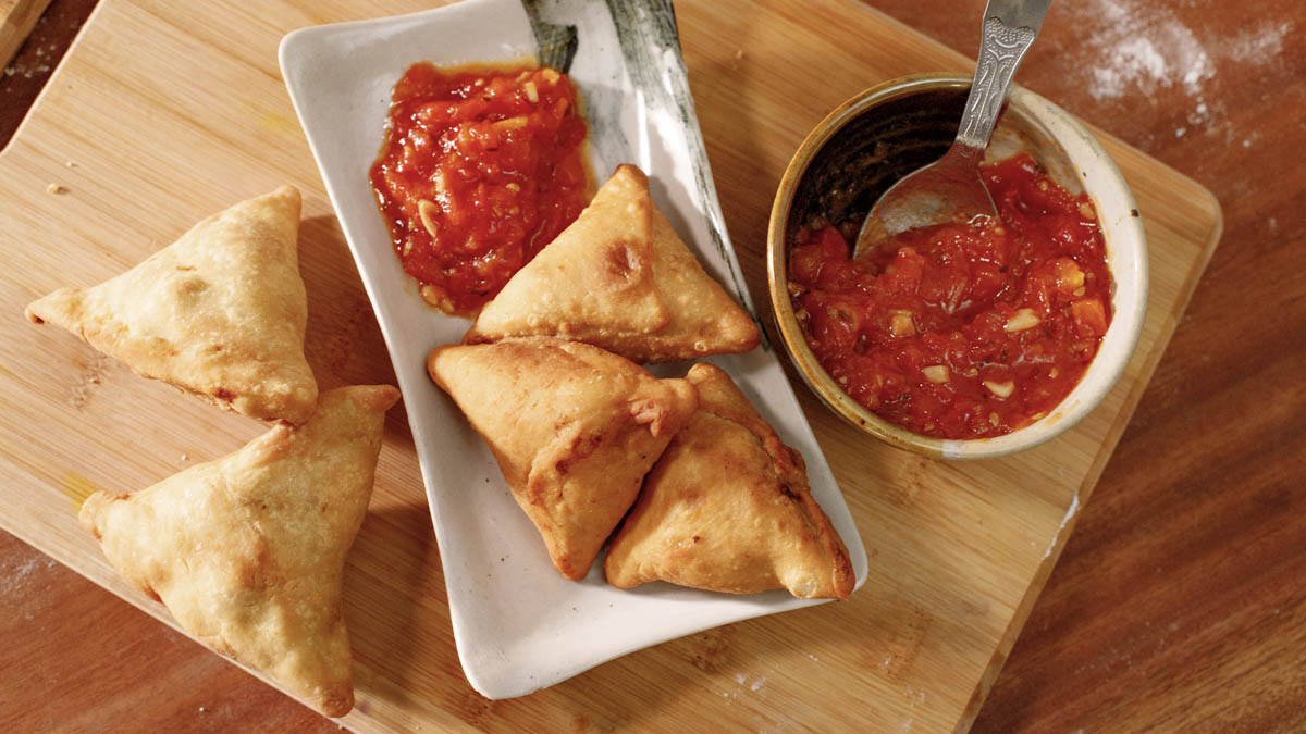 Samosas & Chutney. Asma teaches how to make India's favorite street food, Bengali-style samosas (known as singara), that are stuffed with an aloo gobi filling of cauliflower, potatoes, peanuts, and seasonings like ginger and turmeric. She pairs it with a fiery tomato chutney.