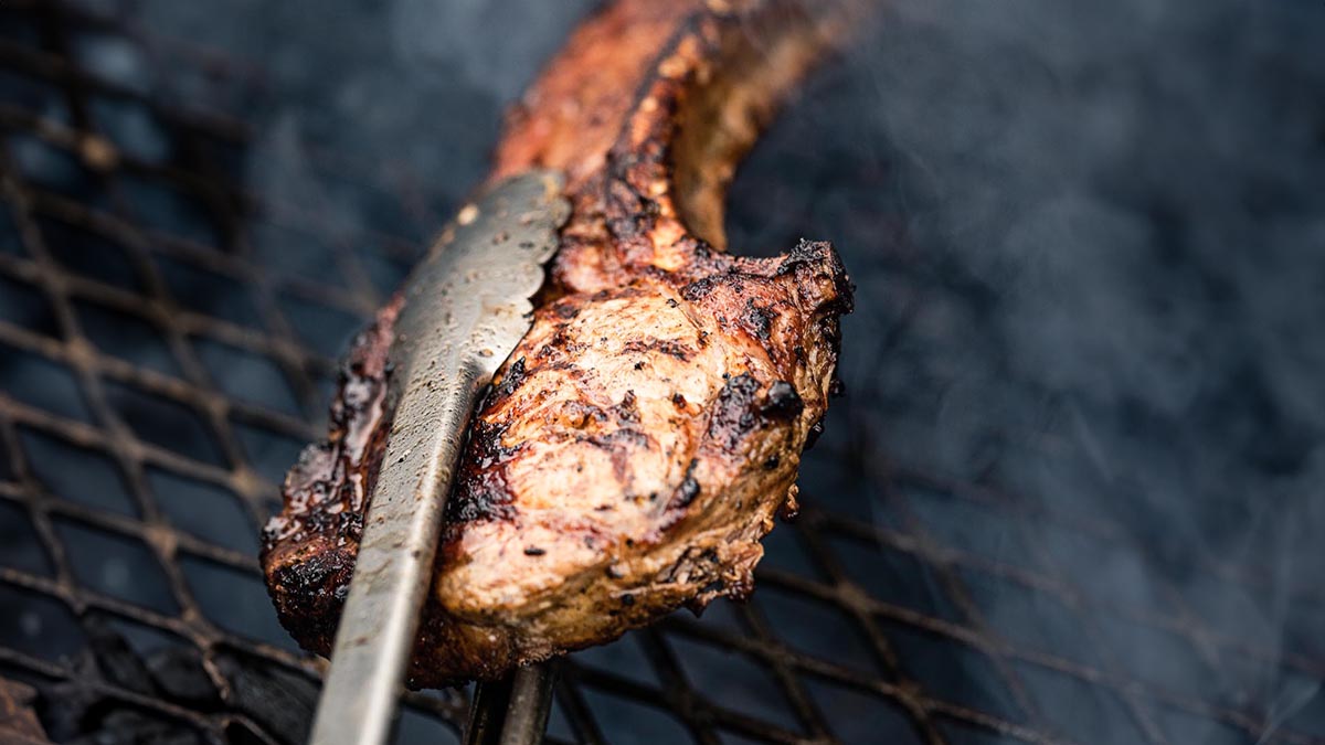 Tomahawk Steaks. Join Edward and Ben, home chef and community leader, as they throw a fun backyard barbecue for their friends and family. Learn Ben's special brine, how to handle a variety of meats and vegetables on the grill, including Tomahawk pork chops, asparagus, and sweet potatoes.