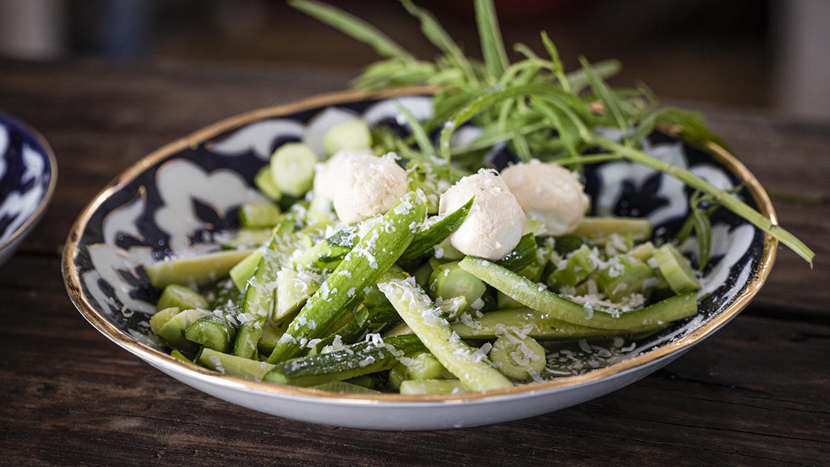 Cucumber & Mint Salad. A joyful bowl of crunchy textures, this refreshing salad combines cucumbers, hot chili pepper, wild mint, and creamy labneh balls.