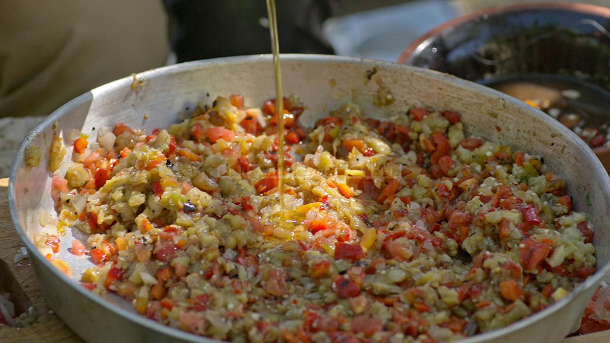 Salata Mashwiya. A delicious spicy Libyan salad with charred eggplant, onions, and peppers. The heat of the peppers balances well with the sweetness of the date honey syrup and fresh mint leaves.