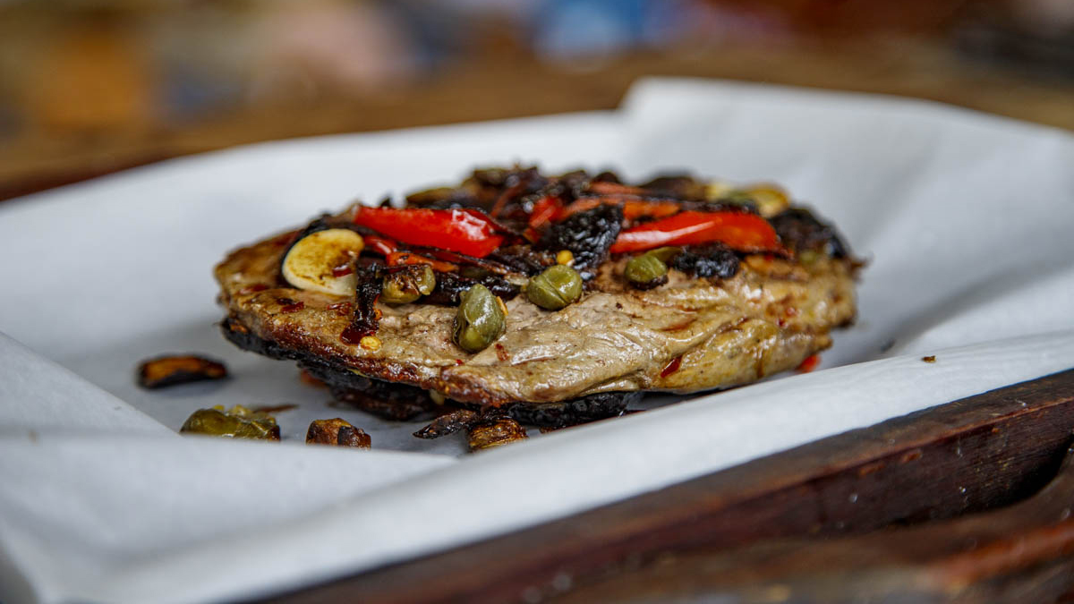 Flattened Tenderloin - Lomo Aplastado. A beautiful steak dinner in under 20 minutes, you say? Francis loves to smash things, and here he teaches how to make this easy and unfussy steak, a dish that he began making over 25 years ago: Flattened tenderloin with capers, peppers, garlic, and black olives. You’ll learn how to respect the steaks’ placement on the grill and the importance of keeping it undisturbed with no “flipping and flopping.”