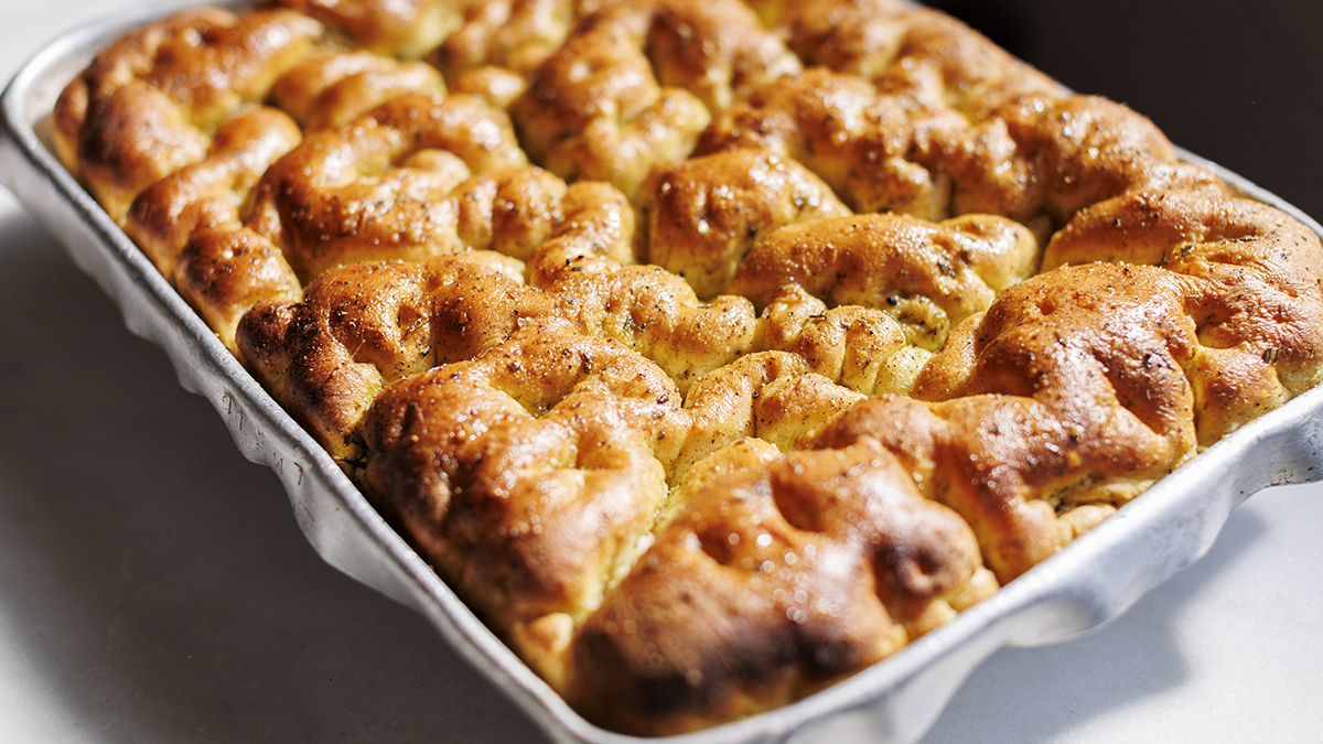 Rosemary & Black Pepper Focaccia. Light and soft with a crispy bottom, this airy focaccia is topped with rosemary and black pepper. A savory bread you’ll want to make again and again.