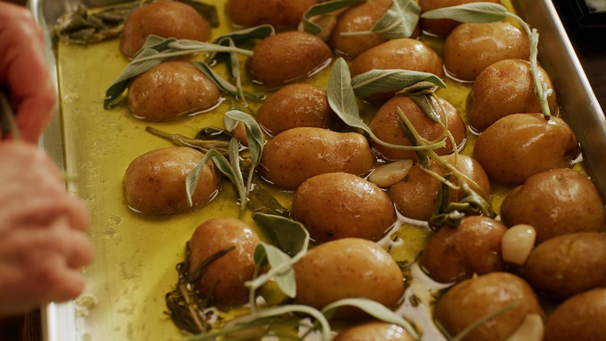 Roasted Potatoes. Learn how to coax the best texture and flavor out of earthy butter potatoes by first confit-ing them in oil, butter, garlic cloves, fresh rosemary and sage.